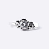 Close-up of Iris Diamond Ring featuring a 0.5 carat round lab-grown diamond with drapery-inspired silver band design