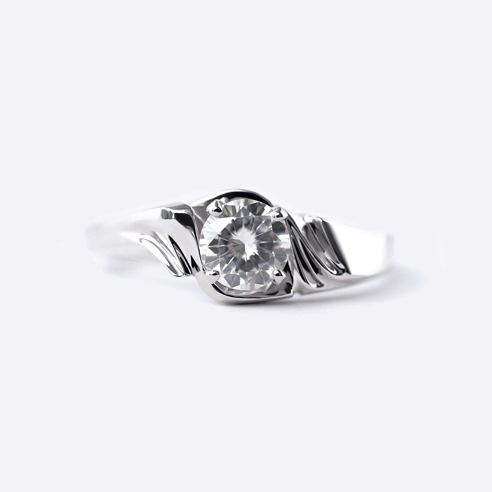 Close-up of Iris Diamond Ring featuring a 0.5 carat round lab-grown diamond with drapery-inspired silver band design