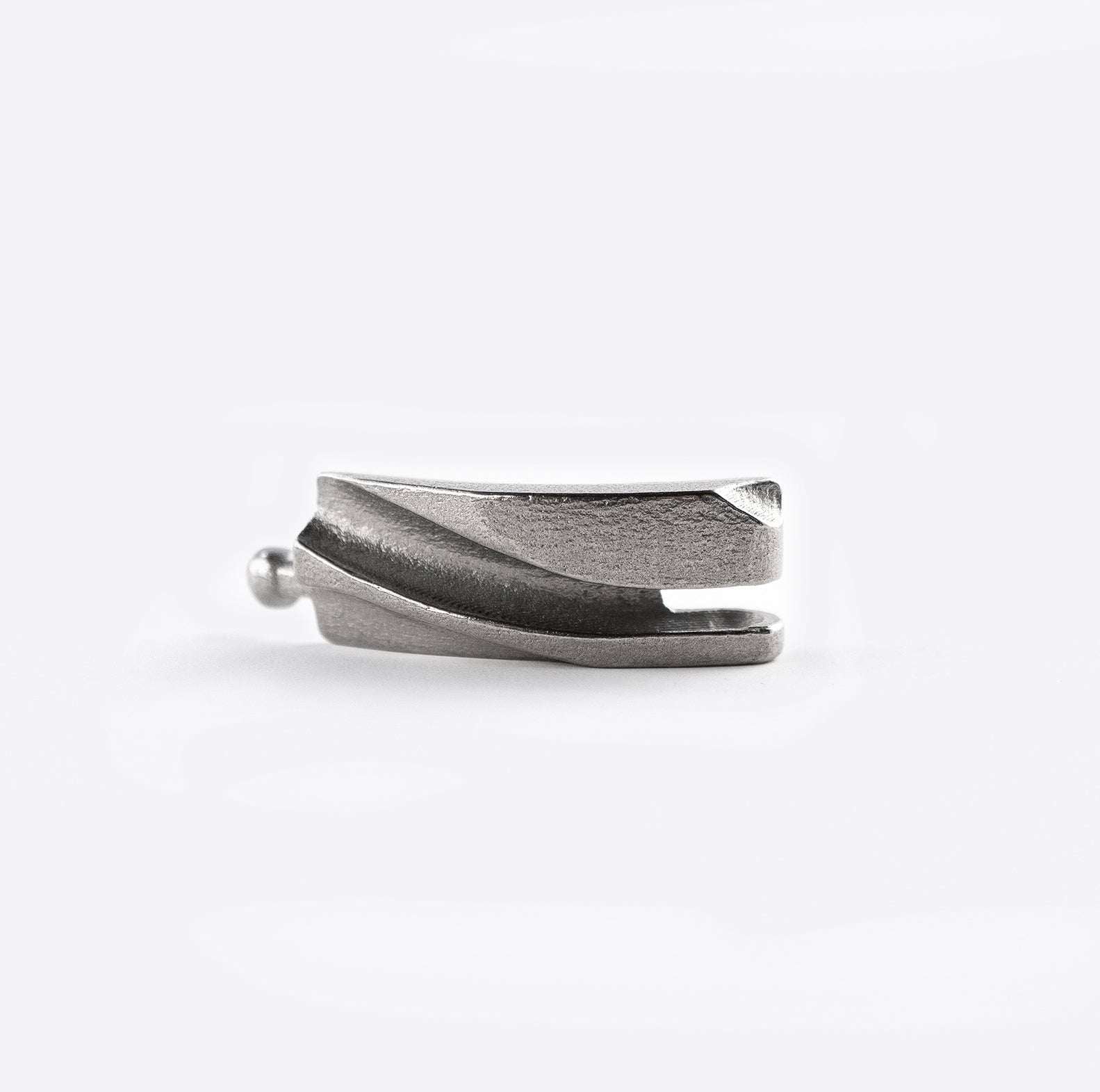 Close-up of a stainless steel matte link from a 3D printed adjustable Link Bracelet with ball joint connection.