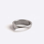 Amor Stainless Steel Ring with twisting band and precision edge detailing on white background