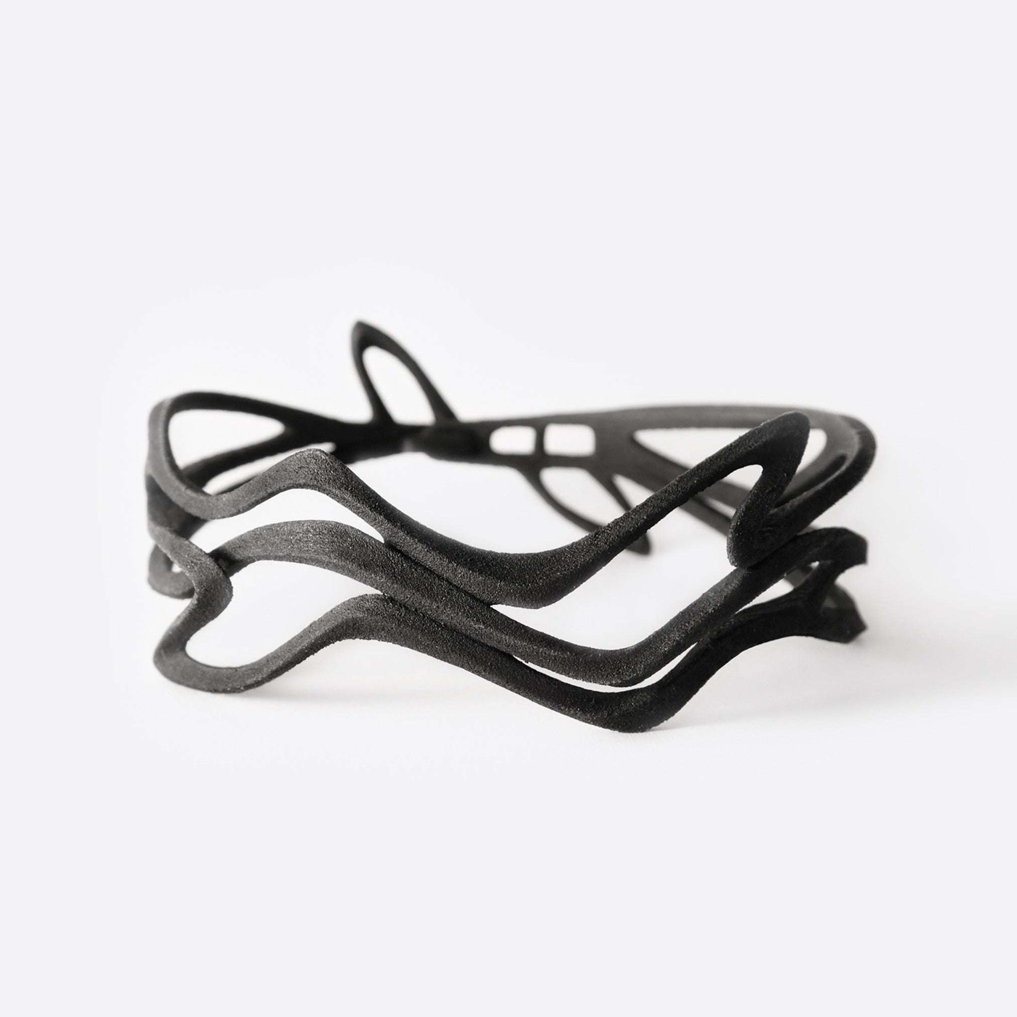 Black Legato NecklaceChoker with twisting, stacking curves and precision edges, 3D printed in flexible TPU polymer.