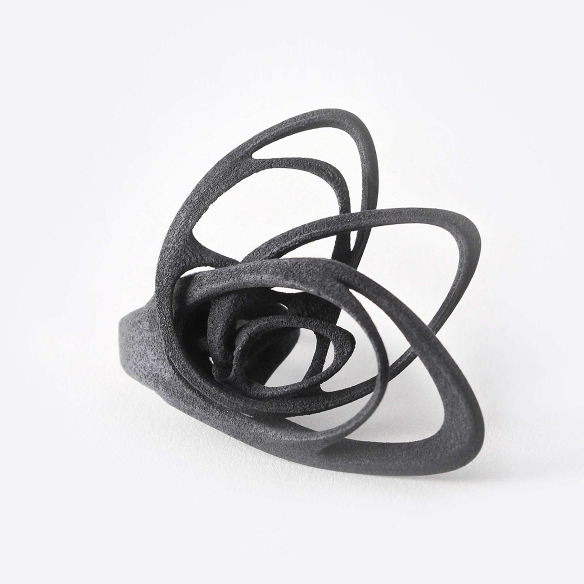 Black polished Papilio Nylon Ring with bold, elliptical petal design and intricate detailing