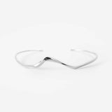 Minimalist sterling silver Interlude Choker with precision edge detailing and organic flow design, adjustable fit.