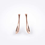 Rose gold Lini earrings with a curved drop shape inspired by a dew drop, available in bold 2-inch length.