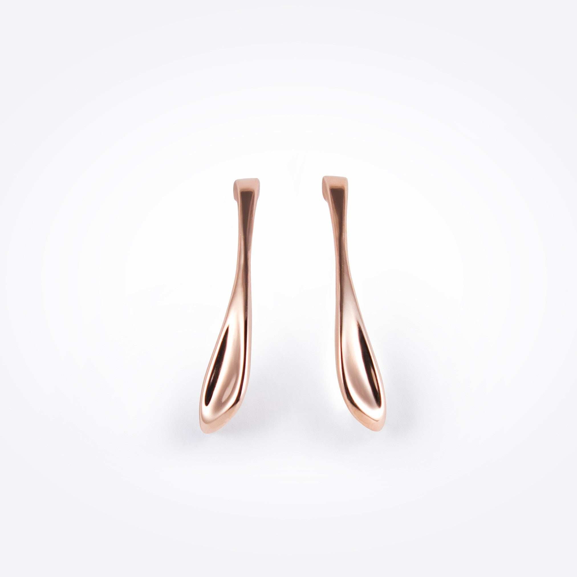 Rose gold Lini earrings with a curved drop shape inspired by a dew drop, available in bold 2-inch length.