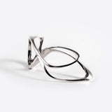Sterling silver Mobius ring with fluid single-line design forming an elliptical petal shape.