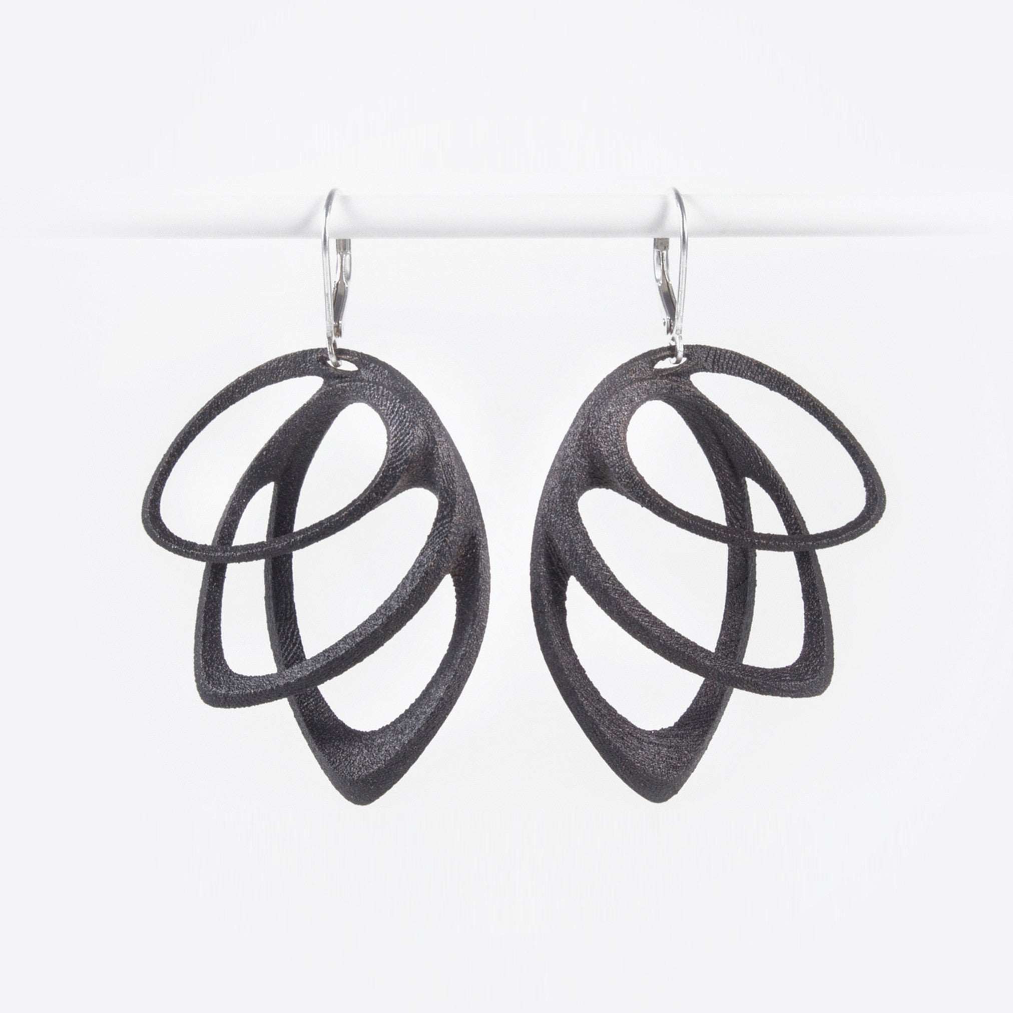 Orbis Steel Earrings in black with three elliptical petals and custom felt pouch