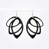 Black polished Orbis Nylon Earrings with three elliptical open loops in descending sizes, hanging on silver hooks