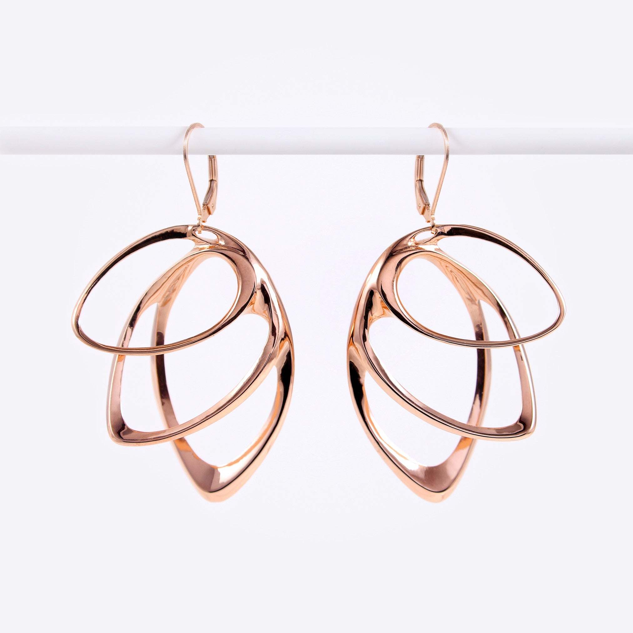 Rose gold Orbis earring with three elliptical petals in a cascading design, 1.7 by 1.2 inches.