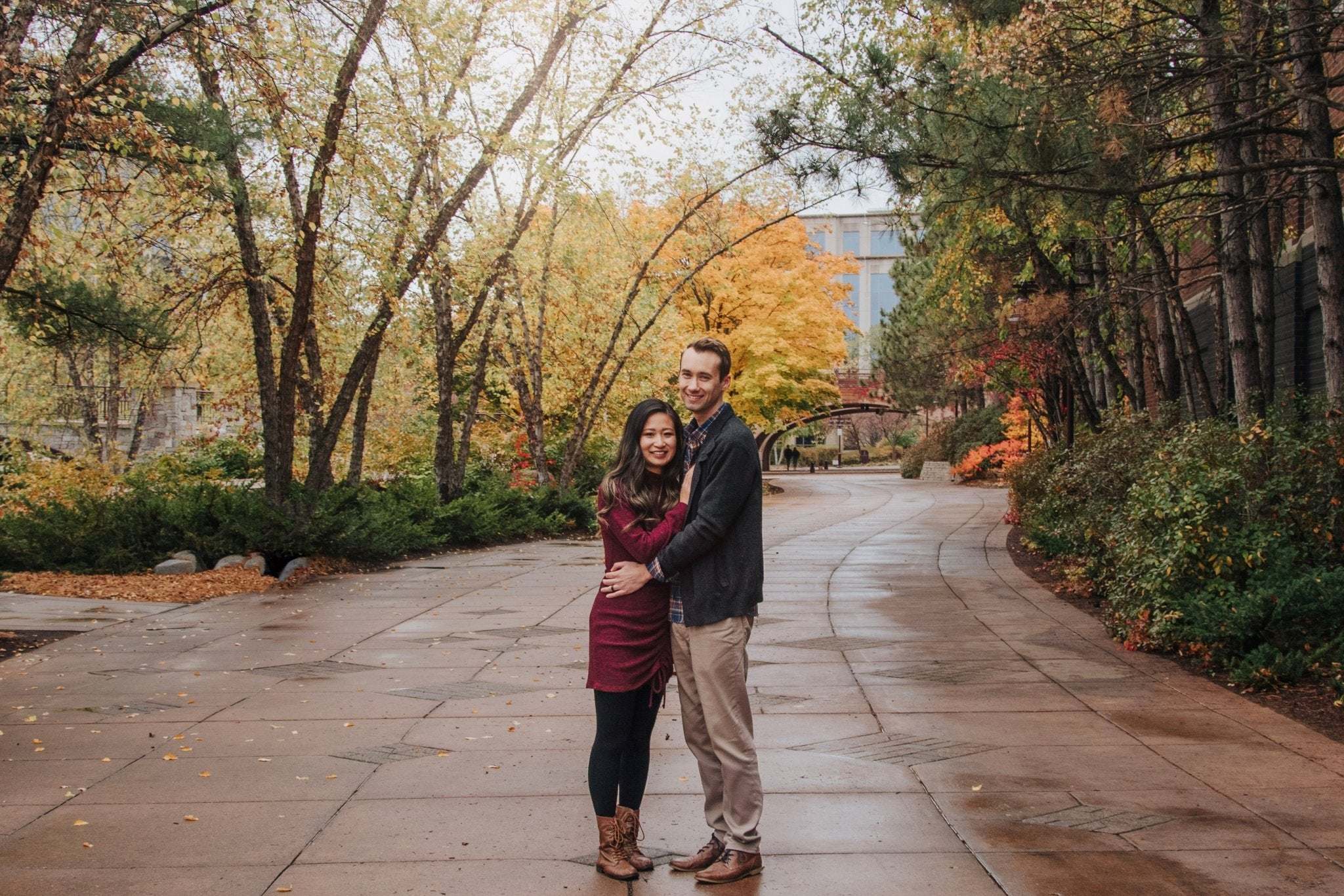 Couple embracing outdoors in autumn park for Proposal Stories article