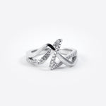 Silver engagement ring sample with crisscross design and embedded stones