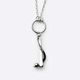 Sterling silver bat-and-ball charm necklace with modern design and polished finish