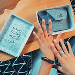 LACE Mystery Box with elegant silver jewelry pieces in reusable felt storage case