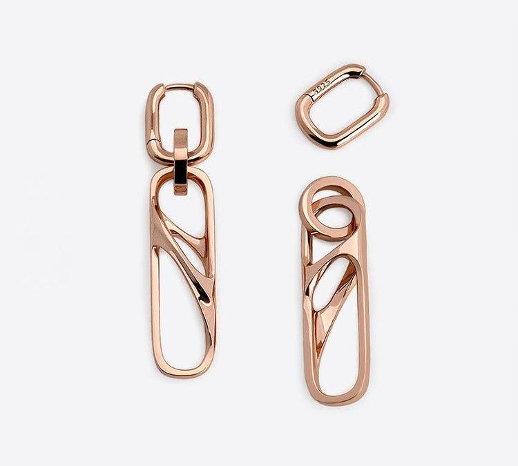 Rose gold dangly earrings set with chain and halo charms in 18K rose gold vermeil