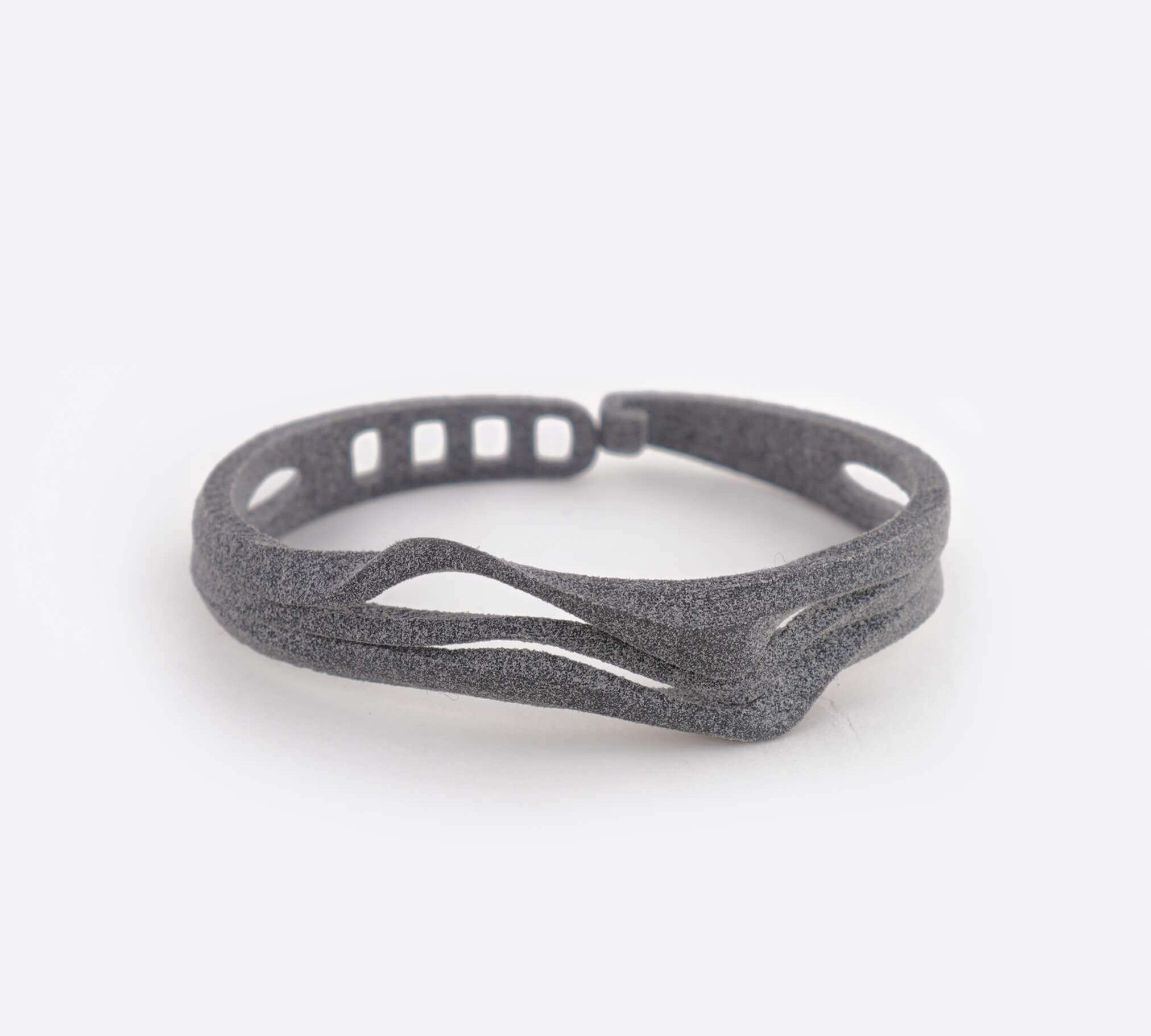 Allegro TPU bracelet in gray with twisting stacked curves and adjustable clasp closure