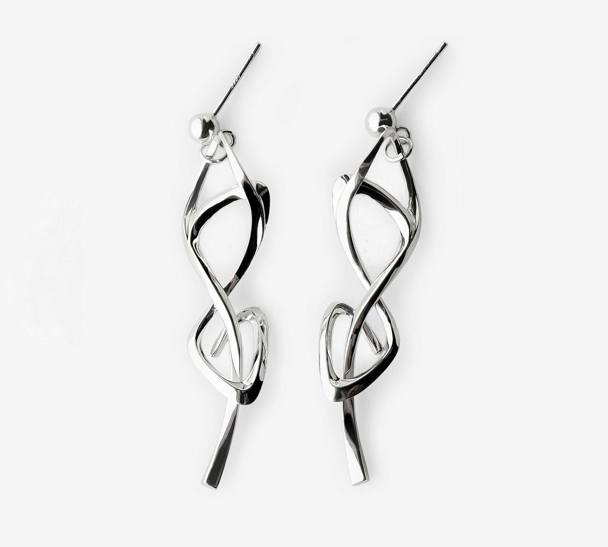 Silver Nova earrings with elegant twisted knot design and high-precision edge detailing