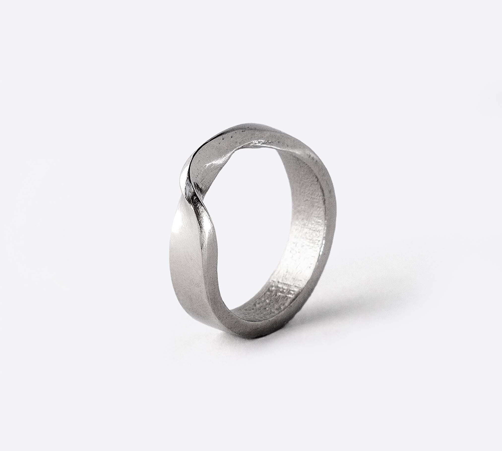 Amor Bold Stainless Steel Ring with twisting band and polished finish