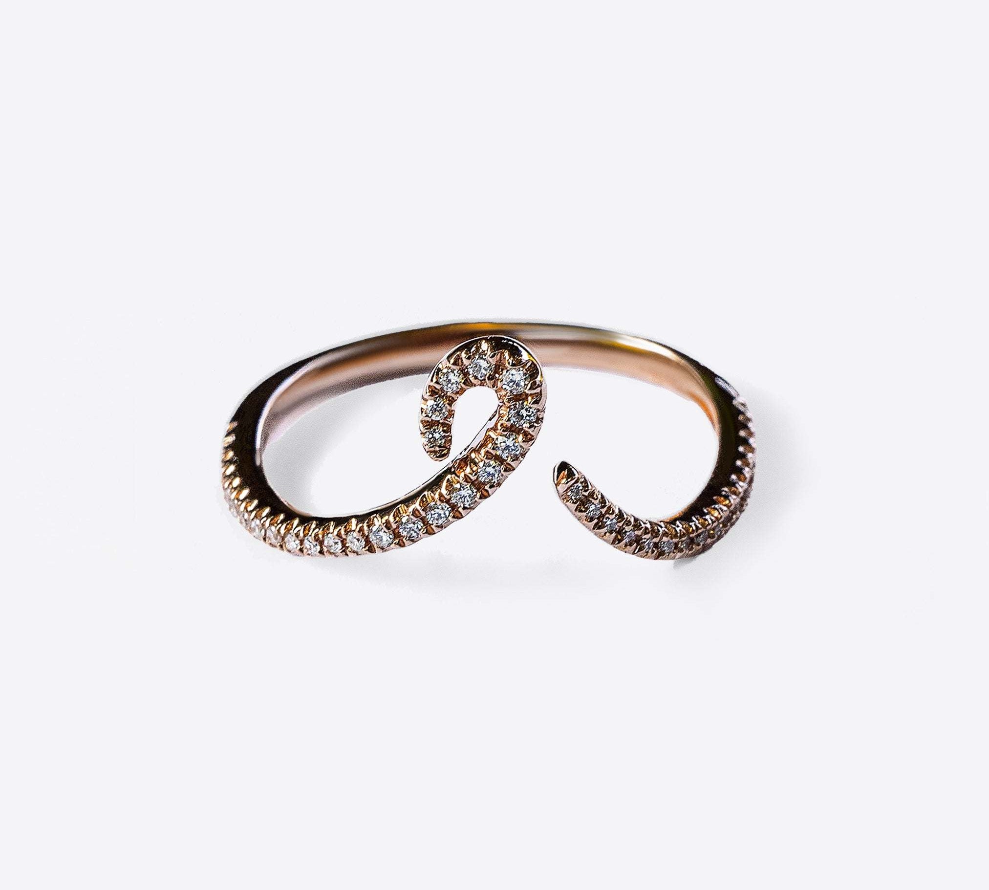 Close-up of Hydra Diamond Ring in 14K gold with curved band adorned with small round brilliant diamonds on white background