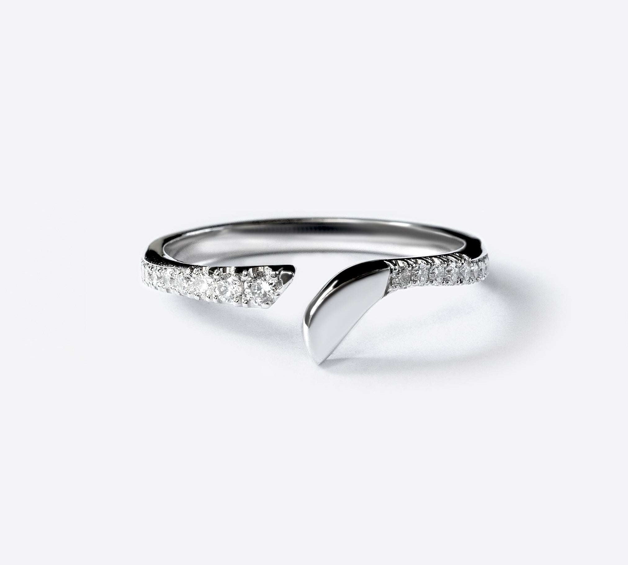 Rosae Wedding Band in platinum with pave diamonds, minimalist petal-shaped design, elegant stacking ring.