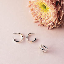 Linea Earrings Set sterling silver mini hoops and ear cuff with pink flower on light background
