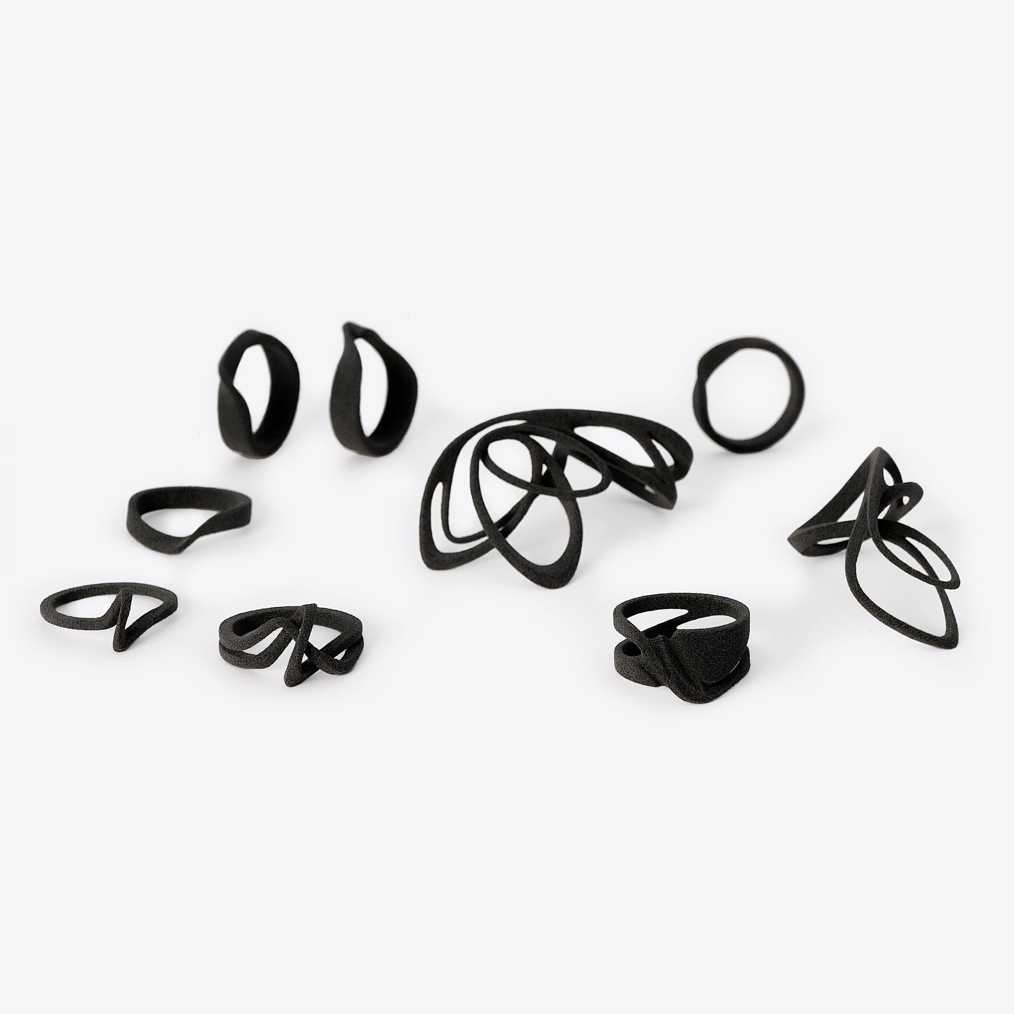 Black nylon ring samples in various lace designs displayed on a white background for ring samples set.