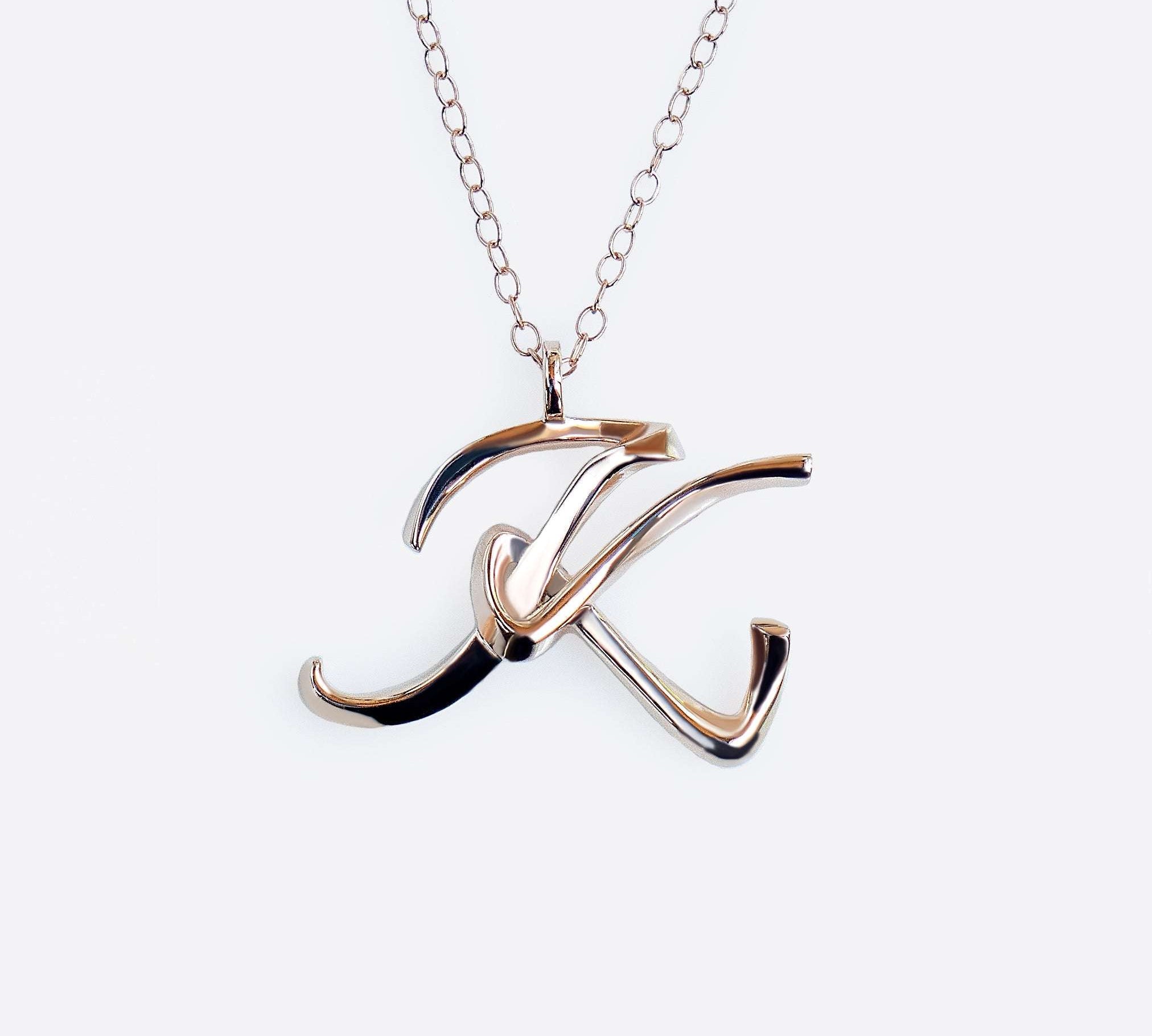 Premium 14K gold initials pendant necklace with precision edge detailing on 16-inch chain