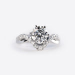 Close-up of a diamond engagement ring sample from the Engagement Ring Samples Set with a twisted band studded with small diamonds