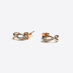 Close-up of Vina Diamond Earrings in mixed gold with pavé diamonds, elegant and lightweight design