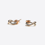 Close-up of Vina Diamond Earrings in mixed gold with pavé diamonds, elegant and lightweight design