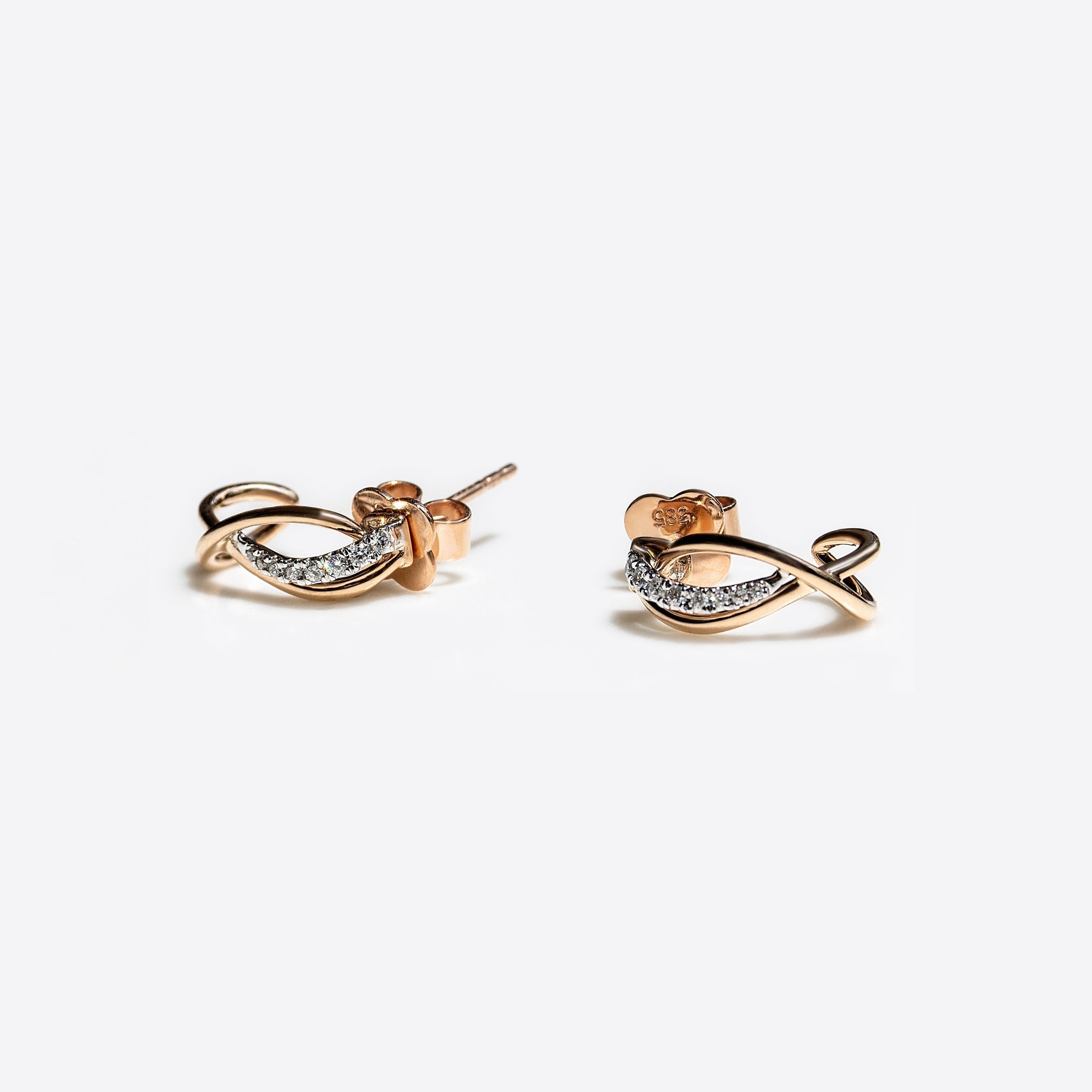 Close-up of Vina Diamond Earrings in mixed gold with pavé diamonds, elegant and lightweight design