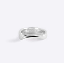 Sterling silver Amor Ring with a sleek twisting band and precision edge detailing on a white background