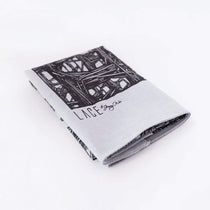 Folded Lineworks Bandana with black signature hand drawing on white premium cotton