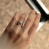 Sterling silver Adagio Velum Set ring with rippling curves on hand