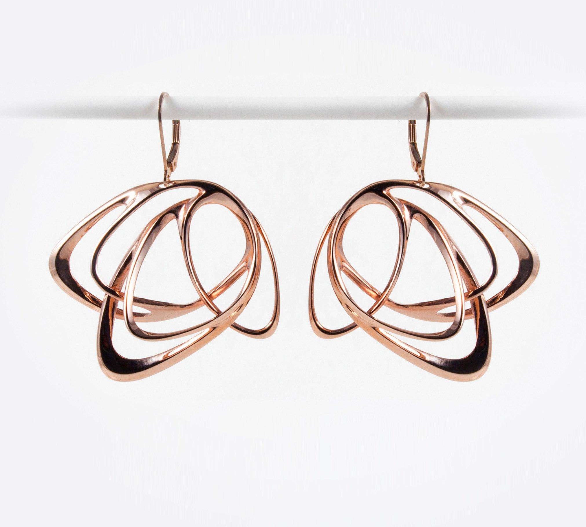 Rose gold Gemino earring with three interlocking elliptical petals design hanging on hooks