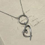 Modern heart charm necklace with open geometric design in sterling silver and rose gold vermeil