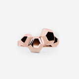 Rose gold Hexa Rings Set featuring hexagonal volumes with undulating surfaces, two nested statement rings in one design.