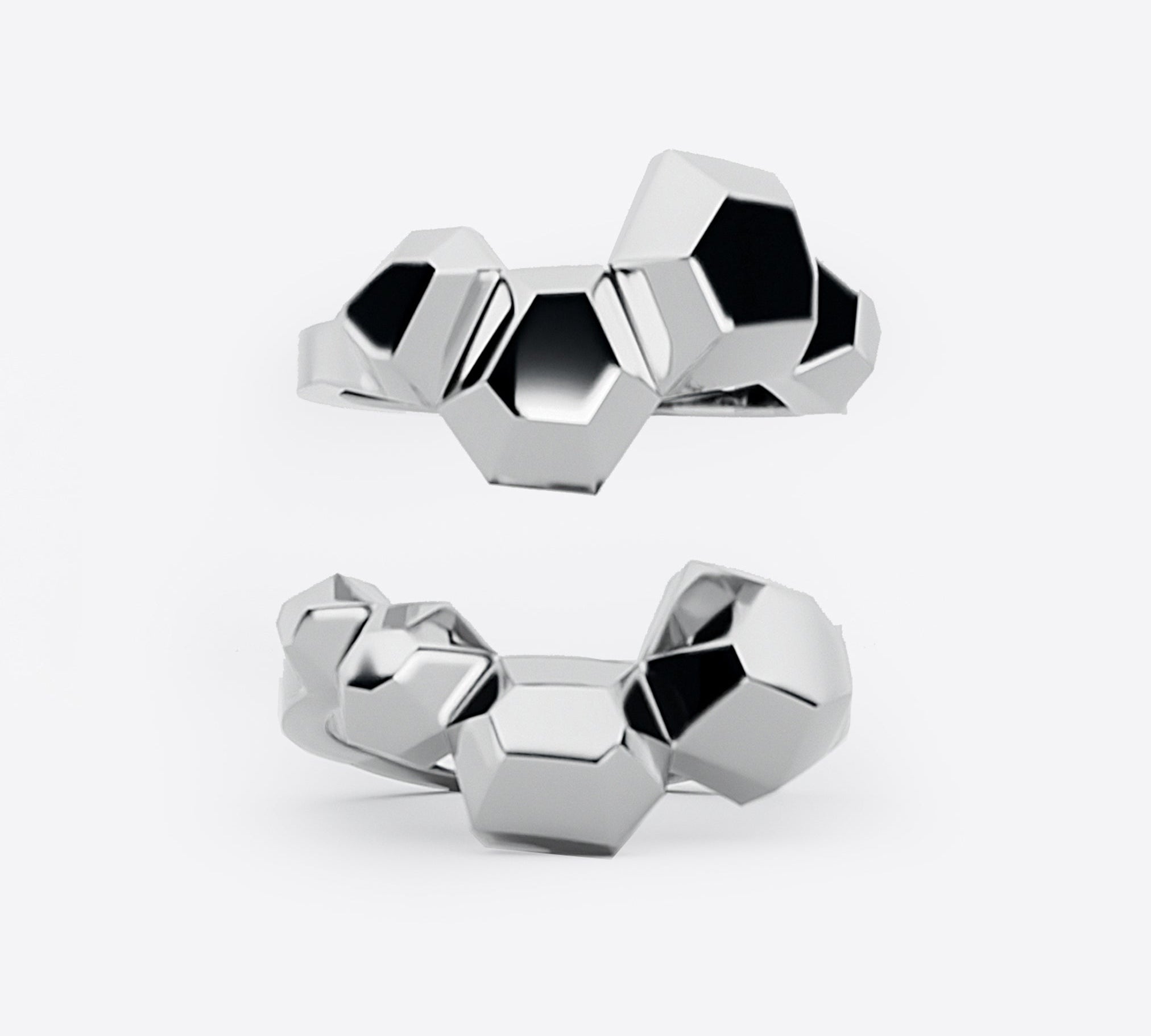 Sterling silver Hexa Rings Set featuring hexagonal geometric design with undulating surfaces, two rings designed to nest together forming a statement ring.
