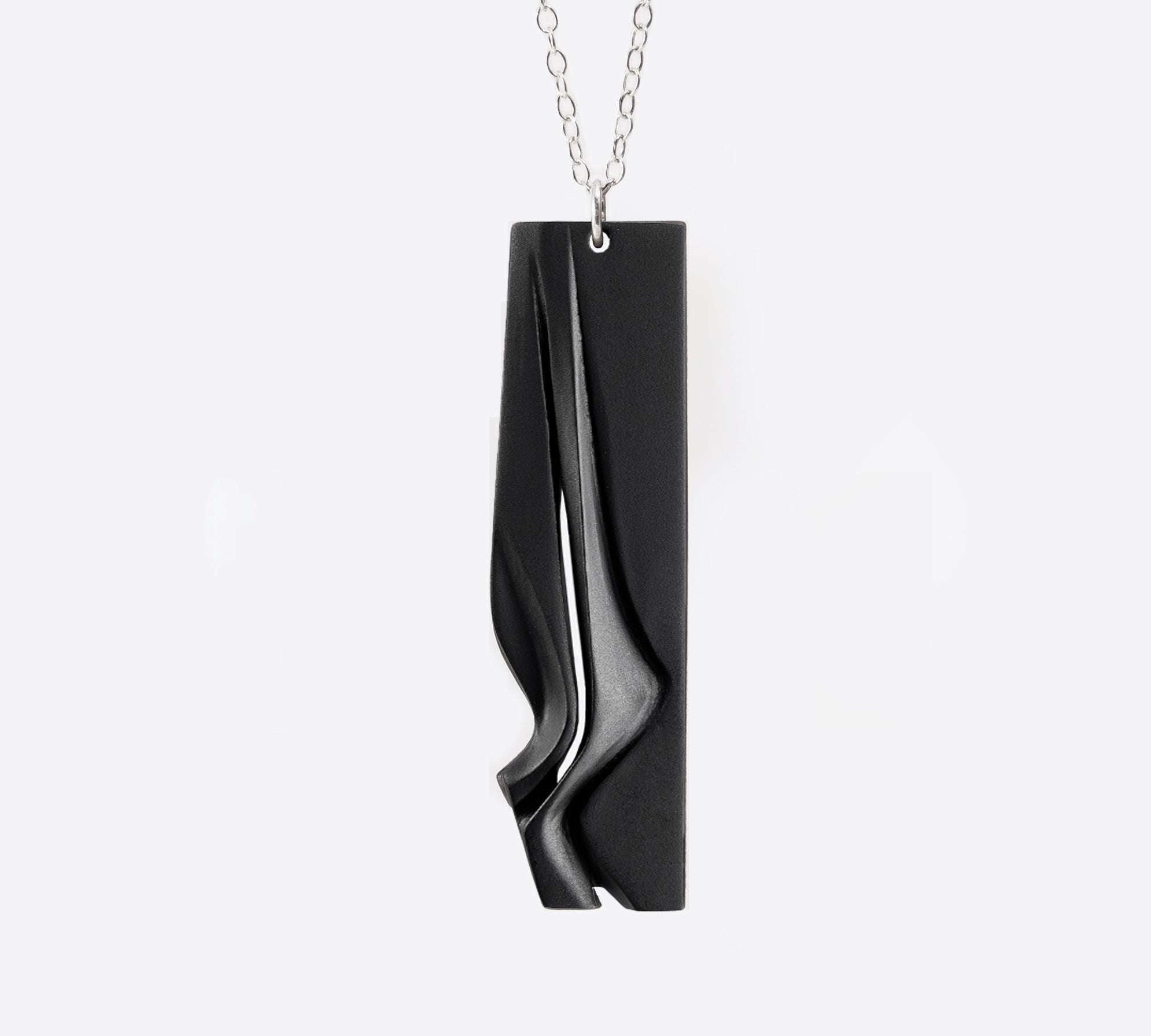 Nocturne Steel Pendant gray steel necklace with twisting stacking curves in modern design