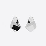 Sterling silver Prism earrings with faceted angular surfaces and a sculptural geometric design.