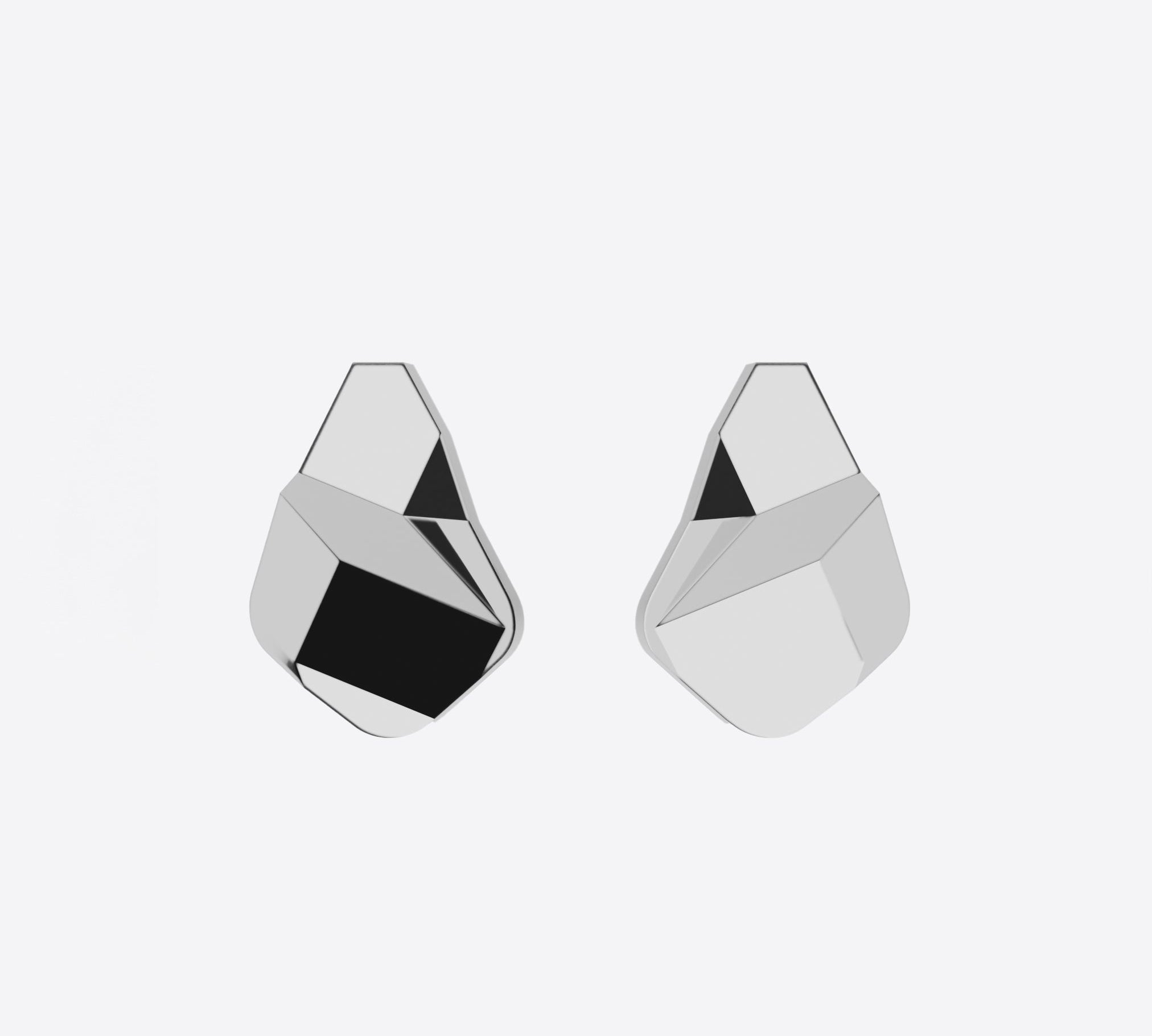 Sterling silver Prism earrings with faceted angular surfaces and a sculptural geometric design.