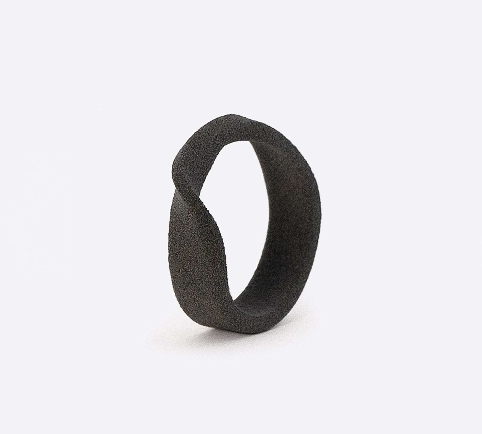 Gray nylon Amor Sample Ring with twisting band and textured surface, 6mm width, flexible fit, sample only.