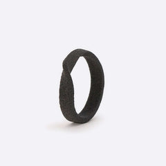 Gray nylon Amor Sample Ring with single twisting band design and precision edge detailing