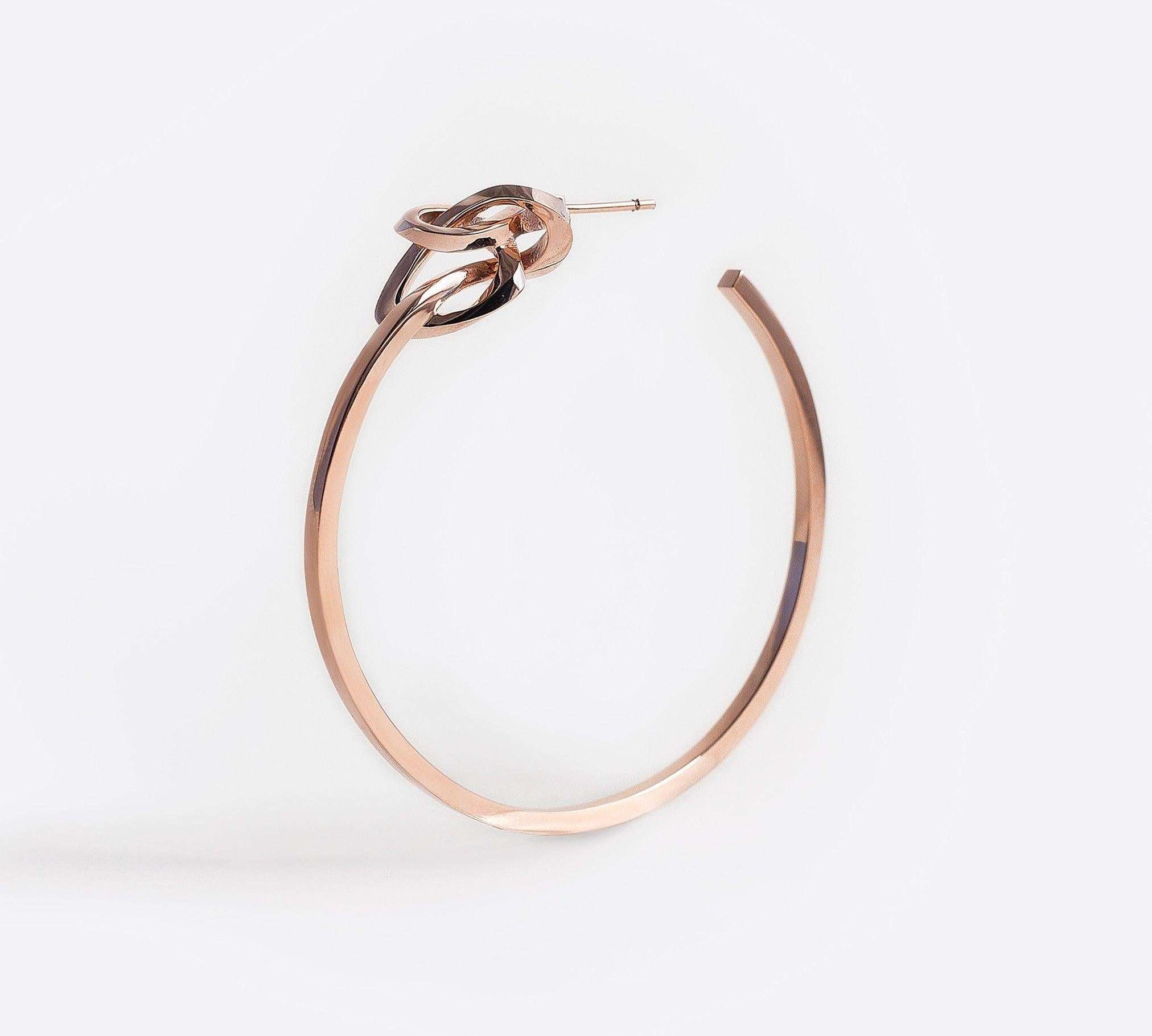 Rose gold vermeil Coda hoop earring with a loose knot detail and precision edges.