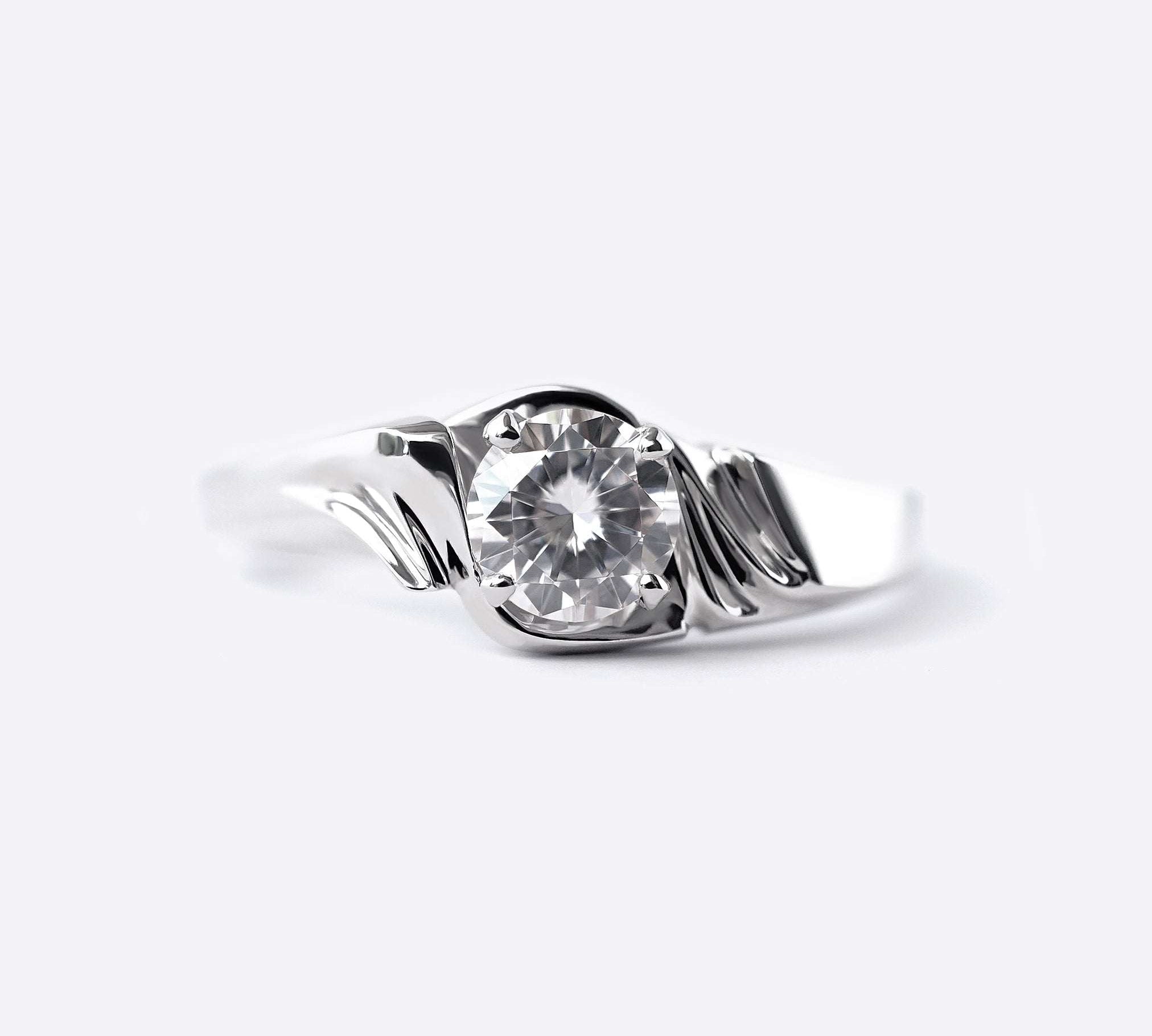 Close-up of Iris Diamond Ring featuring a 0.5 carat round lab-grown diamond with drapery-inspired silver band design
