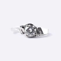 Close-up of Iris Diamond Ring featuring a 0.5 carat round lab-grown diamond with drapery-inspired silver band design