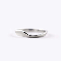 Minimalist Agnes Wedding Band in polished white metal with elegant curved design