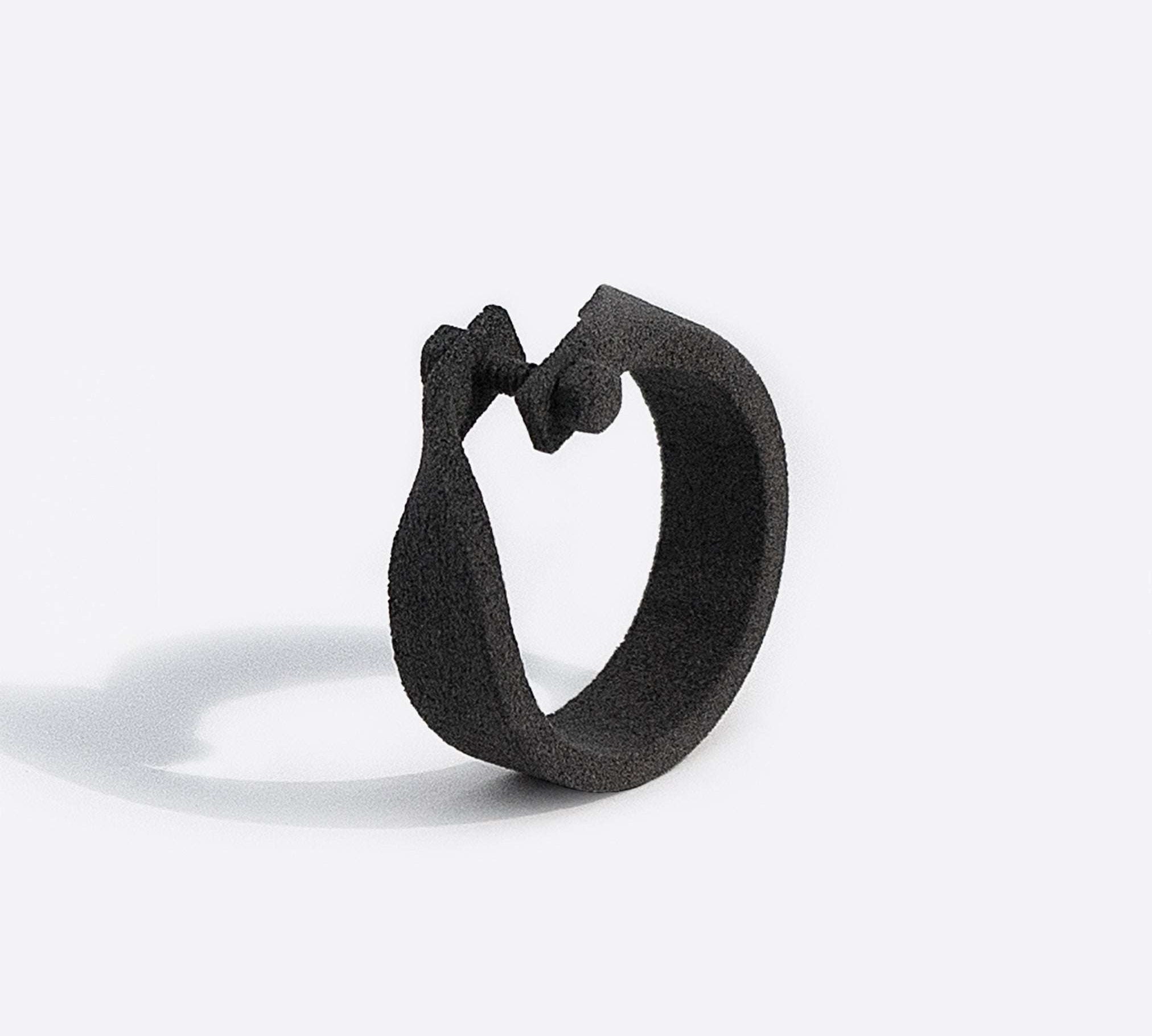 Gray nylon Machina X sample ring with adjustable machined design isolated on white background
