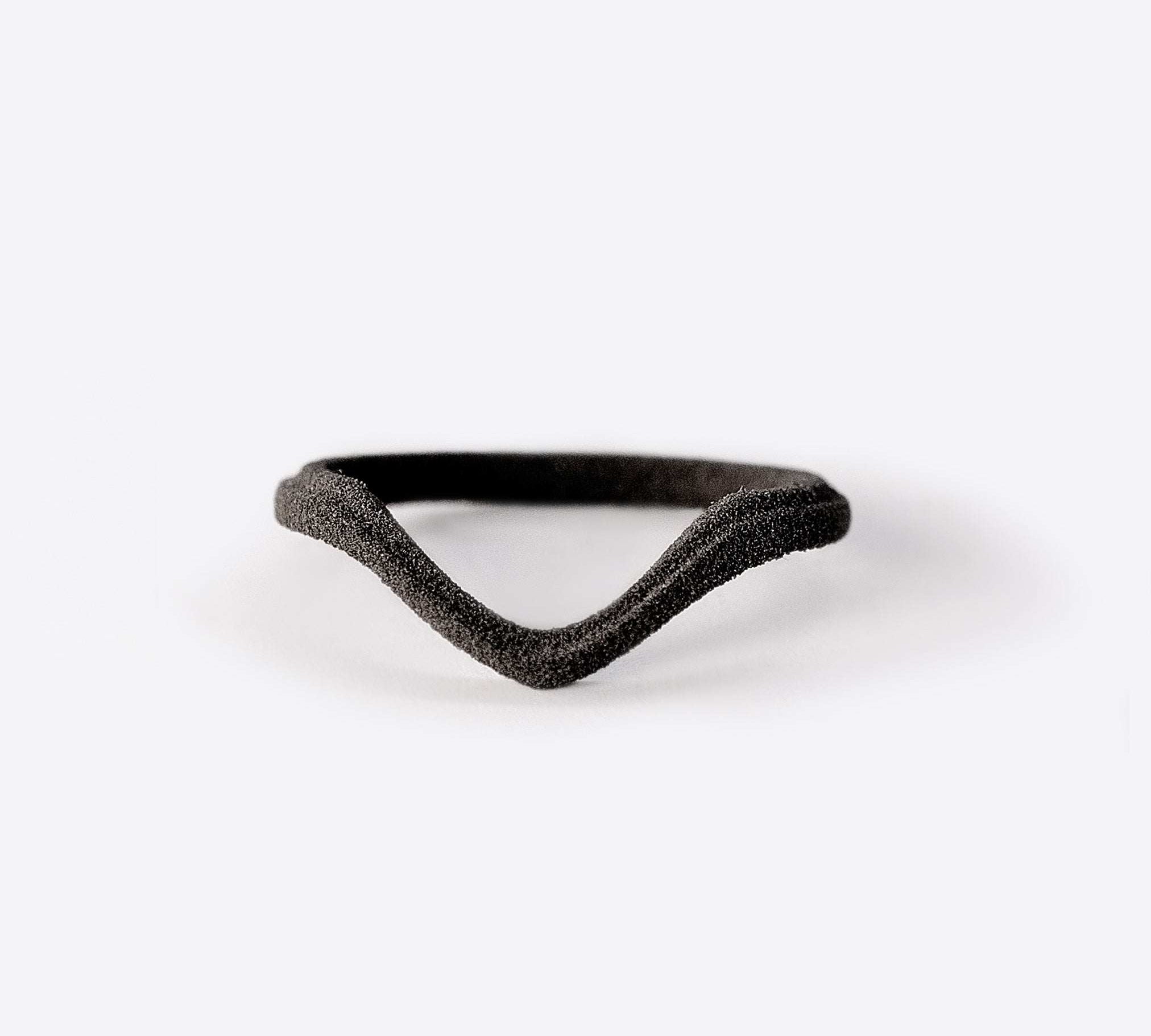 gray nylon Hera sample ring with symmetrical V-shaped design on white background