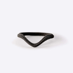 gray nylon Hera sample ring with symmetrical V-shaped design on white background