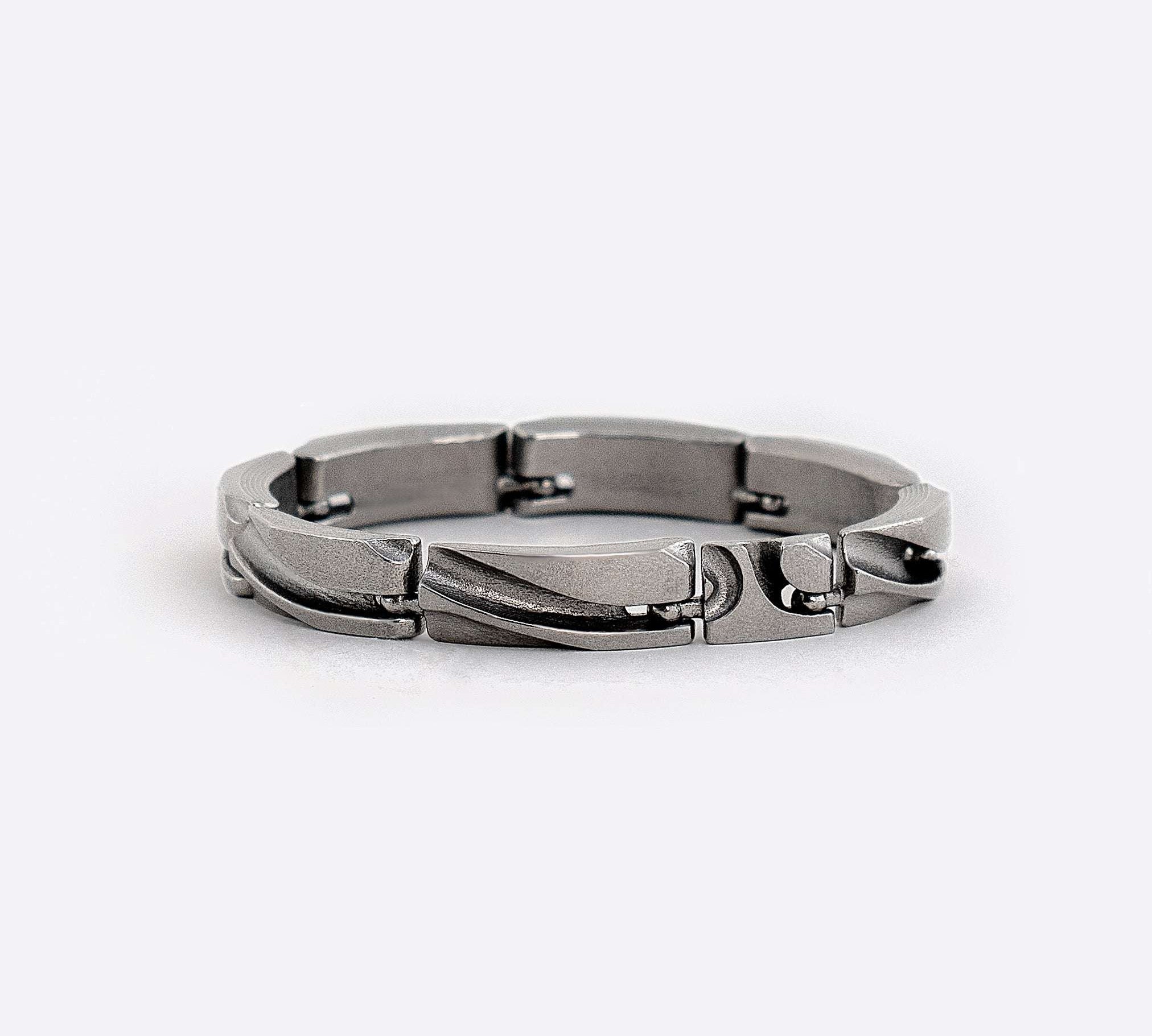 Modern unisex stainless steel link bracelet with unique ball joint connections and adjustable links